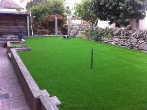Laying artificial grass in back garden bristol