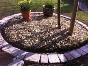 Round pebbled garden feature