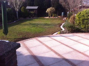 Garden patio and matching brick border with brick centrepiece