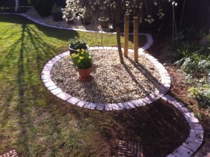 Round pebbled garden feature